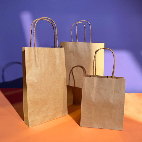 Image of 3 difference sizes of brown kraft paper bags